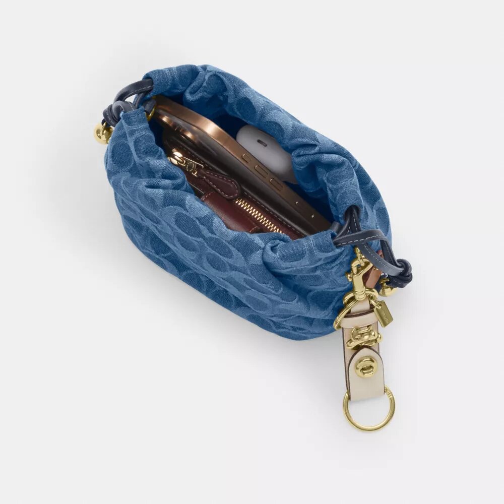 Faye Mini Drawstring Bag in Signature Denim