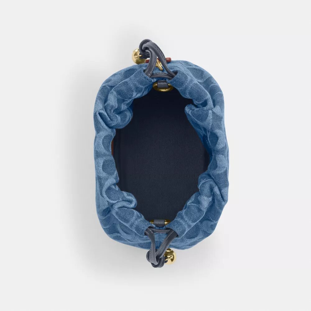 Faye Mini Drawstring Bag in Signature Denim
