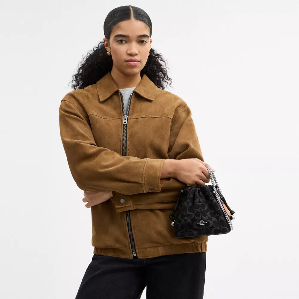 Faye Mini Drawstring Bag in Signature Denim