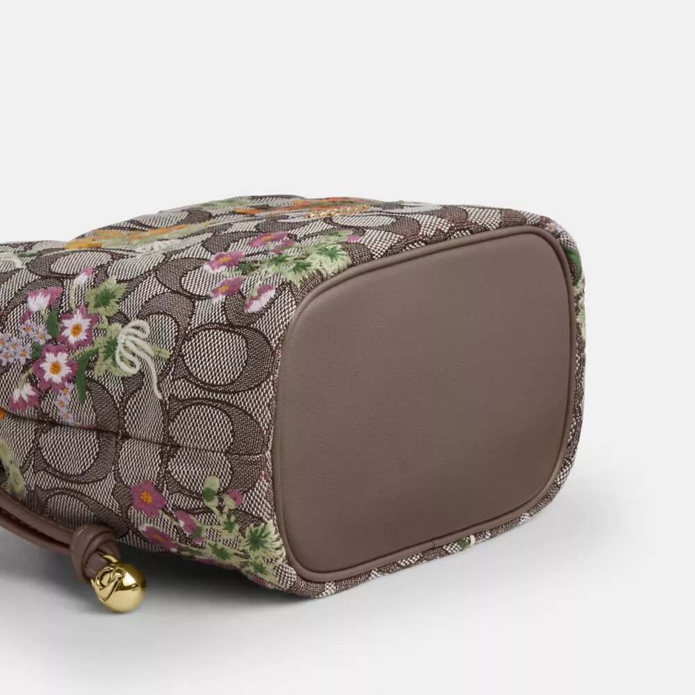 Faye Mini Drawstring Bag in Signature Jacquard with Floral Embroidery