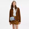 Mini Carey Crossbody Bag in Loved Denim with Charms