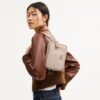 Mini Carey Crossbody Bag in Signature Canvas