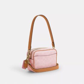 Mini Carey Crossbody Bag in Signature Canvas with Charms