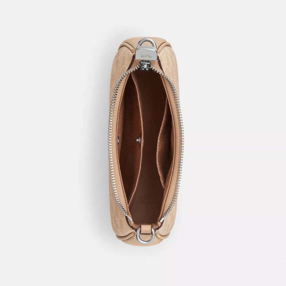 Teri Mini Crossbody Bag in Signature Canvas